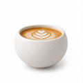 Weiße, runde Keramiktasse ohne Henkel mit Latte Art